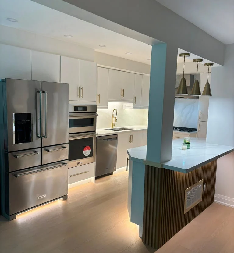 White custom kitchen with illuminated cabinetry and warm wood details, featured on 365 Custom Reno’s existing website